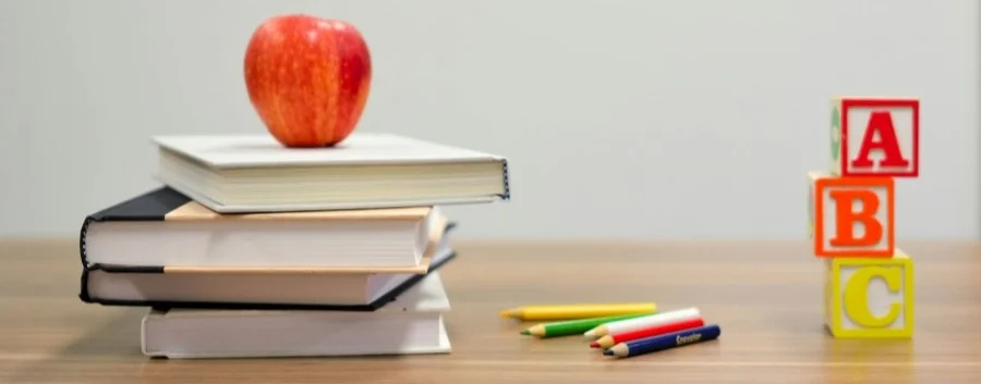 School books and apple